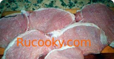 We bake juicy pork with pineapples and cheese in the oven Cooking pork with pineapples